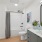 White tile in a well-lit bathroom