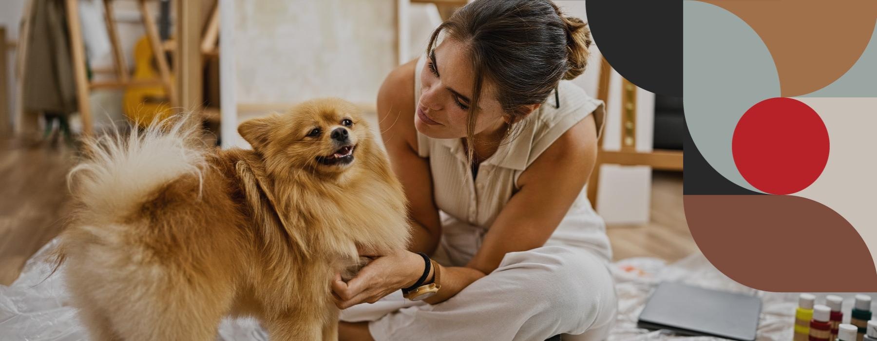 a person sitting next to a dog